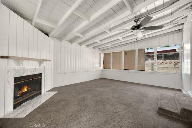 350 E Olive Ave, La Habra, CA 90631 - unfurnished living room featuring a ceiling fan, carpet, a high end fireplace, and beam ceiling