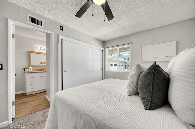 350 E Olive Ave, La Habra, CA 90631 - bedroom with a closet, light colored carpet, ceiling fan, a textured ceiling, and ensuite bathroom