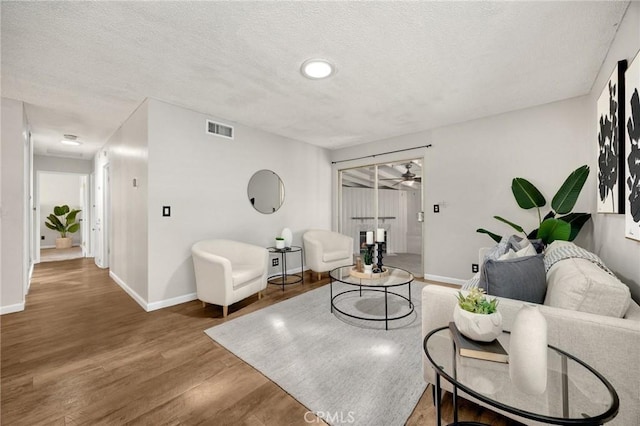 350 E Olive Ave, La Habra, CA 90631 - living room with wood finished floors, ceiling fan, and a textured ceiling