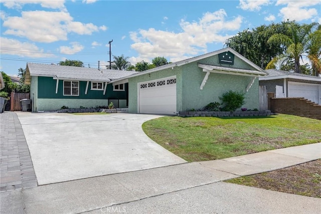 350 E Olive Ave, La Habra, CA 90631 - single story home with a front lawn, a garage, concrete driveway, and stucco siding