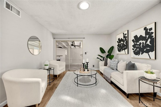 350 E Olive Ave, La Habra, CA 90631 - living area with a textured ceiling and wood finished floors
