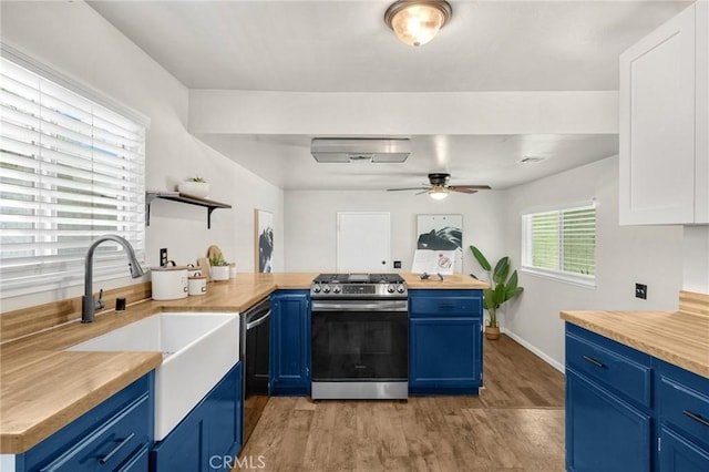 350 E Olive Ave, La Habra, CA 90631 - kitchen featuring gas range, wooden counters, and blue cabinets