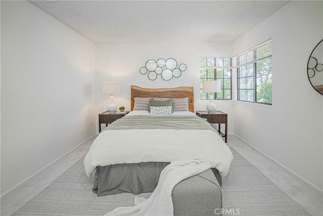 21715 Laurelrim Dr Unit D, Diamond Bar, CA 91765 - carpeted bedroom featuring a textured ceiling and baseboards
