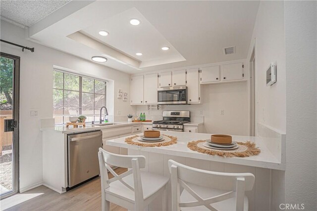 21715 Laurelrim Dr Unit D, Diamond Bar, CA 91765 - kitchen featuring appliances with stainless steel finishes, light countertops, light wood-type flooring, and recessed lighting