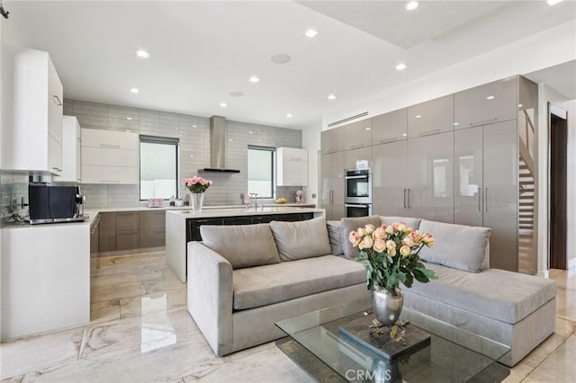 10418 Rubio Ave, Granada Hills, CA 91344 - living area with recessed lighting, stairway, and light marble finish floors