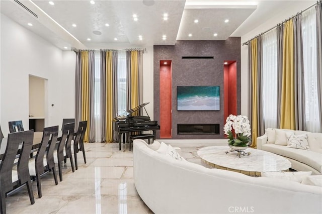 10418 Rubio Ave, Granada Hills, CA 91344 - living room with marble tiled flooring, a glass covered fireplace, and recessed lighting