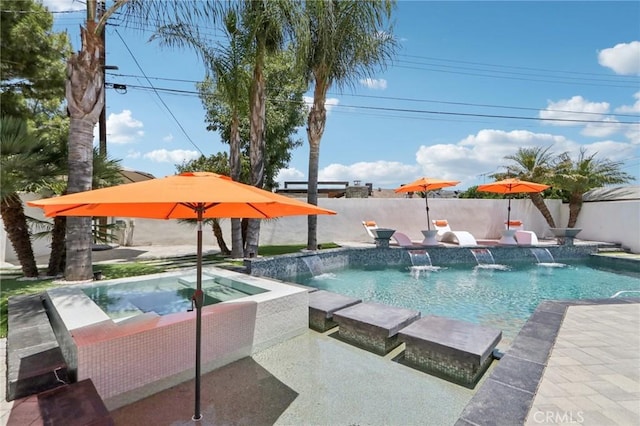 10418 Rubio Ave, Granada Hills, CA 91344 - view of swimming pool with a pool with connected hot tub and a fenced backyard