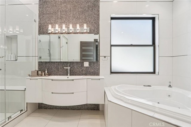 10418 Rubio Ave, Granada Hills, CA 91344 - full bath with a stall shower, vanity, a jetted tub, and tile patterned floors