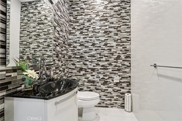10418 Rubio Ave, Granada Hills, CA 91344 - bathroom with vanity, tile patterned floors, tile walls, and backsplash