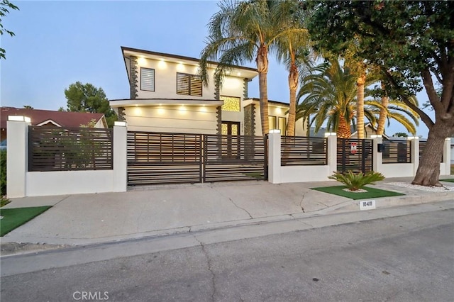 10418 Rubio Ave, Granada Hills, CA 91344 - contemporary home featuring a fenced front yard, a gate, and stucco siding