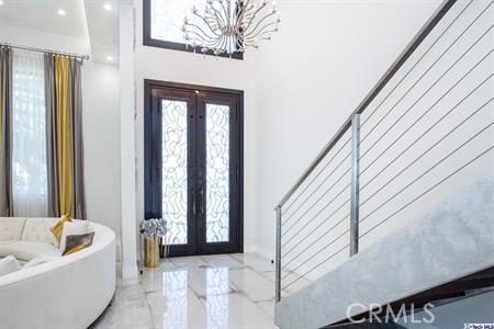 10418 Rubio Ave, Granada Hills, CA 91344 - entryway with french doors, a chandelier, marble tiled flooring, and recessed lighting