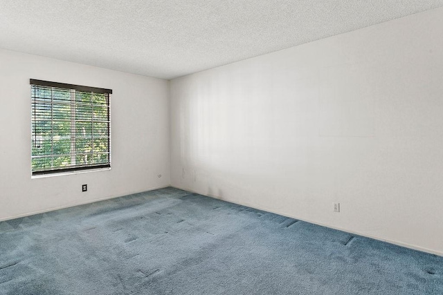 3611 S Bear St Unit K, Santa Ana, CA 92704 - carpeted spare room featuring a textured ceiling