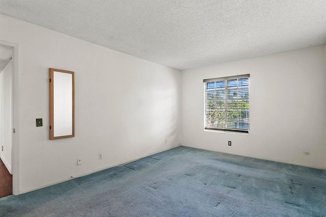 3611 S Bear St Unit K, Santa Ana, CA 92704 - empty room featuring carpet and a textured ceiling