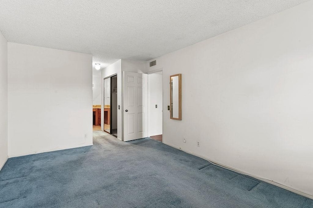3611 S Bear St Unit K, Santa Ana, CA 92704 - carpeted spare room featuring a textured ceiling