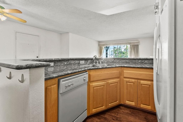 3611 S Bear St Unit K, Santa Ana, CA 92704 - kitchen featuring white appliances, dark wood finished floors, a textured ceiling, a ceiling fan, and dark stone countertops