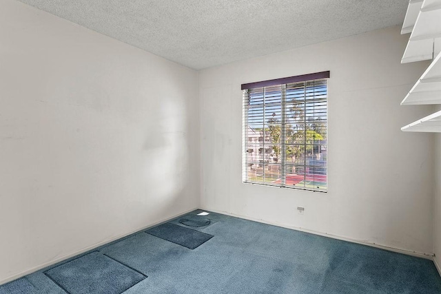 3611 S Bear St Unit K, Santa Ana, CA 92704 - carpeted spare room featuring a textured ceiling