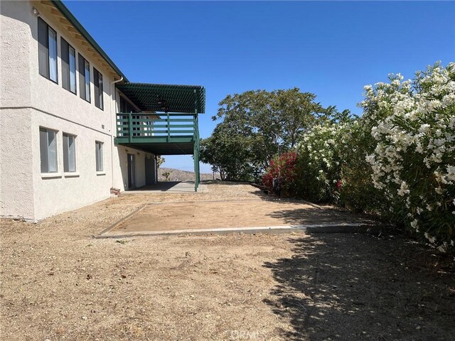 28714 Cruthers Creek Rd, Pearblossom, CA 93553 - view of yard featuring a patio area and a balcony