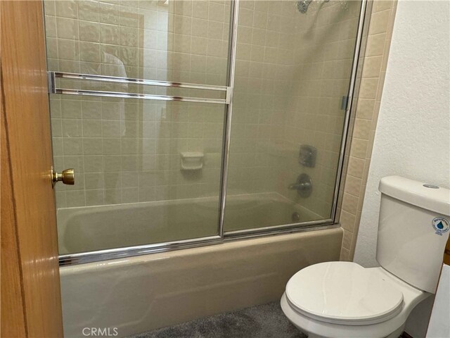 28714 Cruthers Creek Rd, Pearblossom, CA 93553 - bathroom with combined bath / shower with glass door and a textured wall