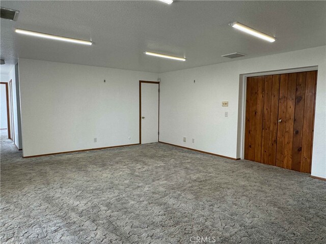 28714 Cruthers Creek Rd, Pearblossom, CA 93553 - carpeted empty room featuring baseboards