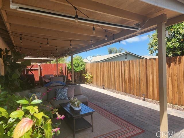4430 Avenida Del Gado, Oceanside, CA 92057 - fenced backyard with an outdoor hangout area and a patio