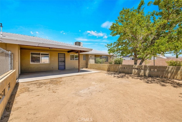 7535 Hilton Ave, Yucca Valley, CA 92284 - rear view of house with stucco siding and a patio area