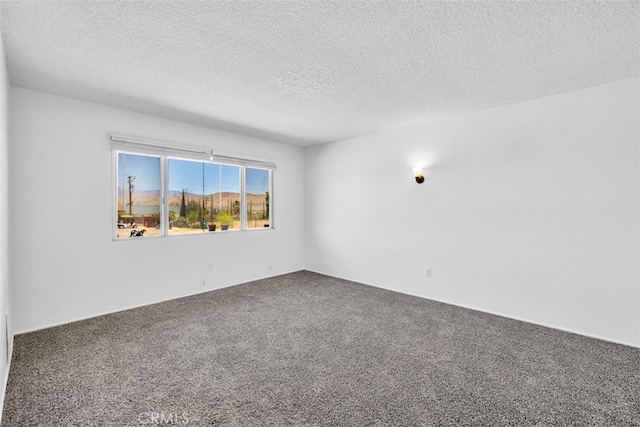 7535 Hilton Ave, Yucca Valley, CA 92284 - spare room featuring carpet and a textured ceiling