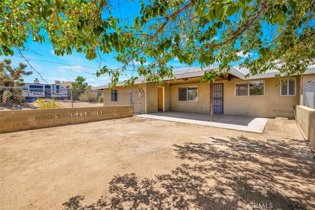 7535 Hilton Ave, Yucca Valley, CA 92284 - back of house featuring stucco siding and a patio area