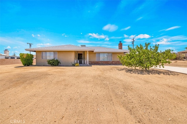 7535 Hilton Ave, Yucca Valley, CA 92284 - ranch-style home featuring a chimney and stucco siding