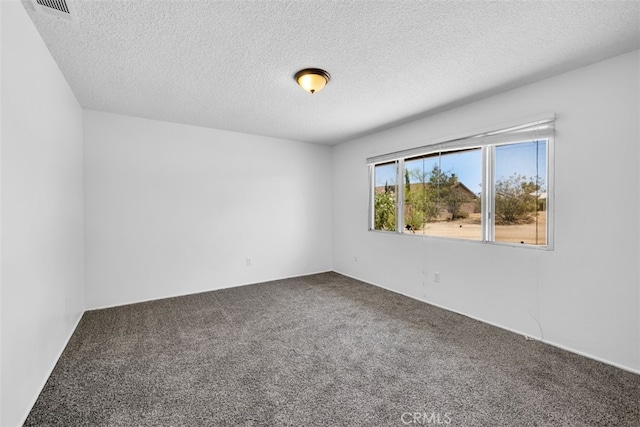 7535 Hilton Ave, Yucca Valley, CA 92284 - carpeted spare room featuring a textured ceiling