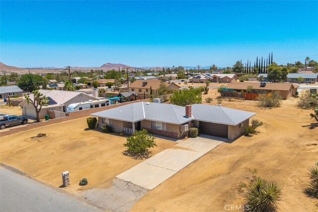 7535 Hilton Ave, Yucca Valley, CA 92284 - aerial perspective of suburban area with a mountain backdrop