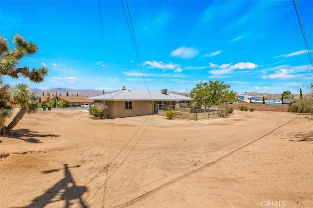7535 Hilton Ave, Yucca Valley, CA 92284 - rear view of house featuring a mountain view