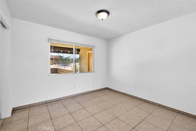 7535 Hilton Ave, Yucca Valley, CA 92284 - spare room with a textured ceiling and baseboards