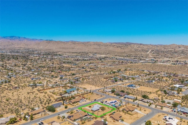 7535 Hilton Ave, Yucca Valley, CA 92284 - aerial overview of property's location featuring a desert landscape and property boundaries highlighted