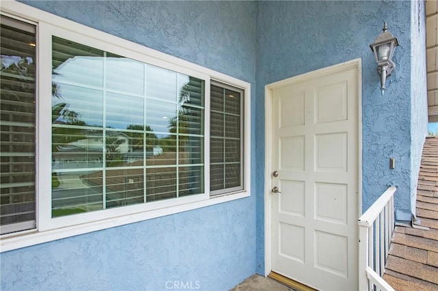 34561 Calle Portola, Dana Point, CA 92624 - doorway to property featuring stucco siding