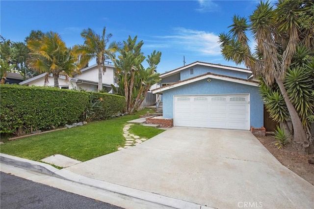 34561 Calle Portola, Dana Point, CA 92624 - view of front facade with a front yard, stucco siding, driveway, and a garage