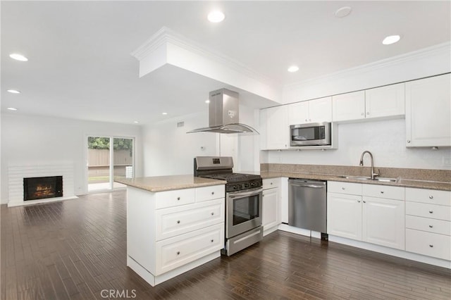 34561 Calle Portola, Dana Point, CA 92624 - kitchen with stainless steel appliances, island exhaust hood, a peninsula, white cabinets, and ornamental molding