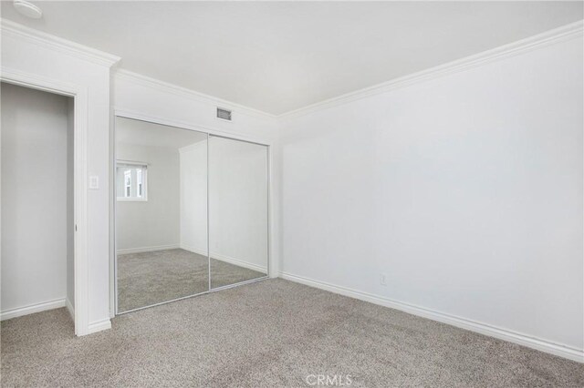 34561 Calle Portola, Dana Point, CA 92624 - unfurnished bedroom featuring carpet, ornamental molding, and a closet