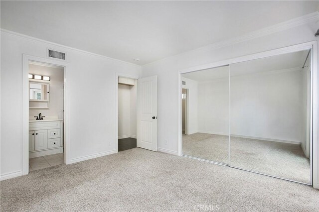 34561 Calle Portola, Dana Point, CA 92624 - unfurnished bedroom featuring carpet, a closet, ornamental molding, and ensuite bath