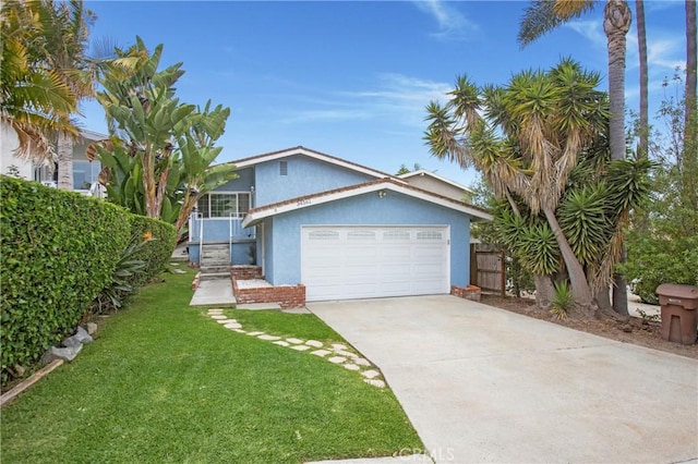 34561 Calle Portola, Dana Point, CA 92624 - view of front of home with stucco siding, concrete driveway, and an attached garage