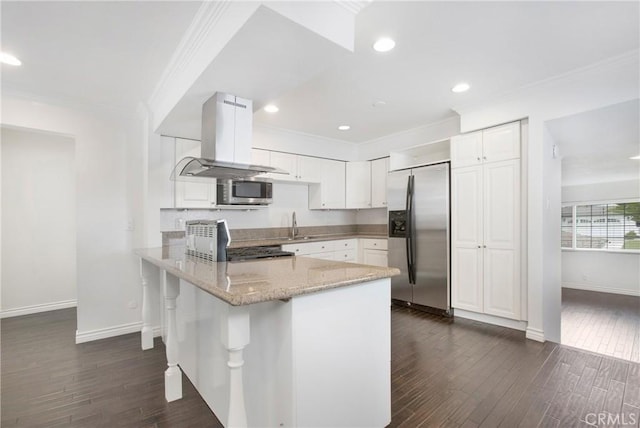 34561 Calle Portola, Dana Point, CA 92624 - kitchen with stainless steel appliances, island range hood, crown molding, a peninsula, and white cabinetry