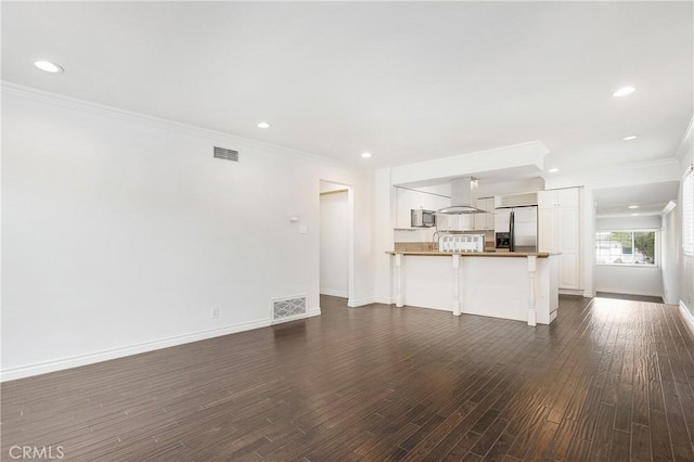 34561 Calle Portola, Dana Point, CA 92624 - unfurnished living room featuring ornamental molding, dark wood finished floors, and recessed lighting