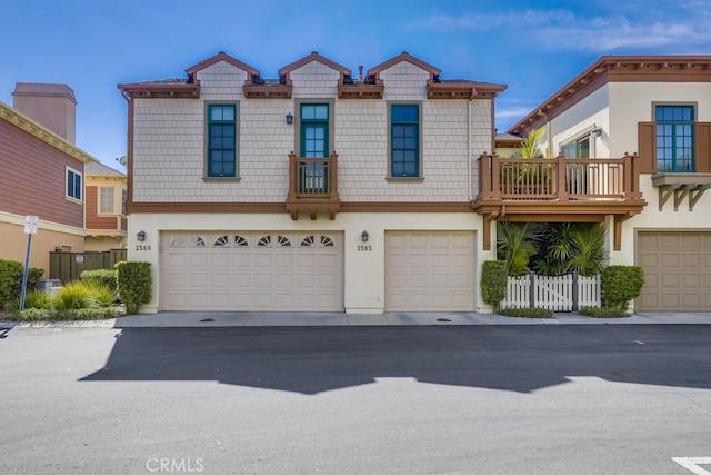 2569 Bungalow Pl, Corona Del Mar, CA 92625 - view of front of home featuring an attached garage and stucco siding
