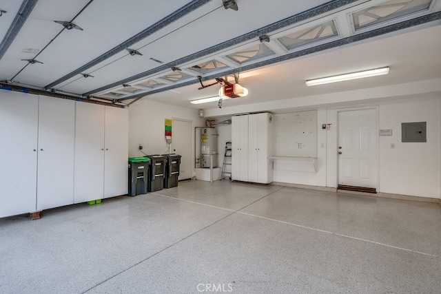 2569 Bungalow Pl, Corona Del Mar, CA 92625 - garage with a garage door opener, water heater, and electric panel