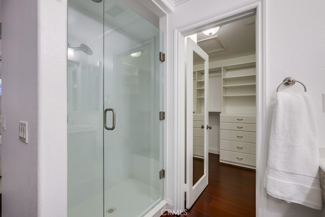 2569 Bungalow Pl, Corona Del Mar, CA 92625 - full bath featuring a stall shower, wood finished floors, and a walk in closet