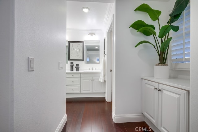 2569 Bungalow Pl, Corona Del Mar, CA 92625 - hallway featuring dark wood-type flooring and ornamental molding