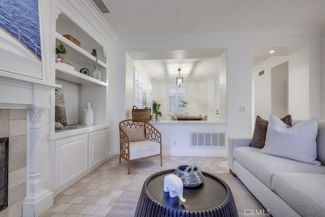 2569 Bungalow Pl, Corona Del Mar, CA 92625 - living room with a tile fireplace, built in features, and crown molding