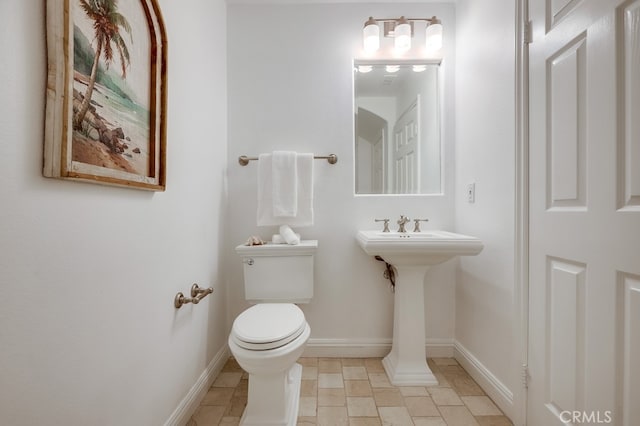 2569 Bungalow Pl, Corona Del Mar, CA 92625 - bathroom featuring toilet and stone tile floors