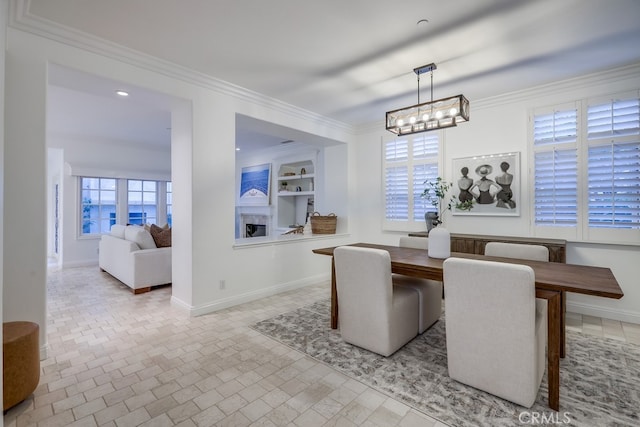 2569 Bungalow Pl, Corona Del Mar, CA 92625 - dining room with ornamental molding, a chandelier, and built in features