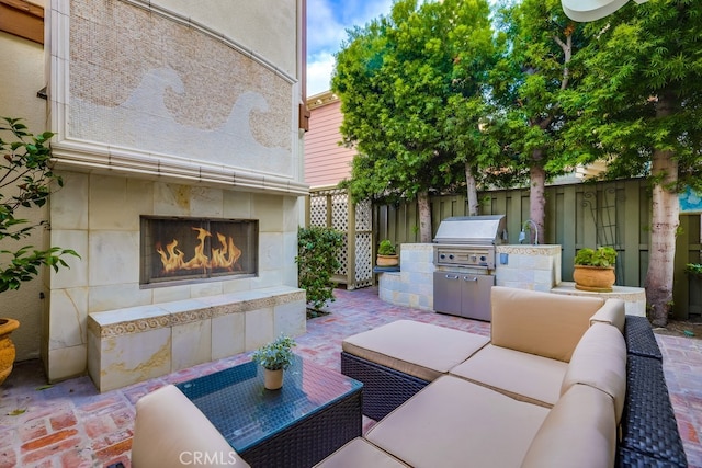 2569 Bungalow Pl, Corona Del Mar, CA 92625 - view of patio with an outdoor kitchen and an outdoor living space with a fireplace
