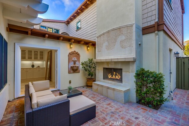 2569 Bungalow Pl, Corona Del Mar, CA 92625 - view of patio / terrace featuring an outdoor living space with a fireplace